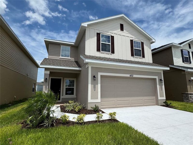Front exterior of a new home in Harmony Central, Harmony, FL, highlighting curb appeal (Image 13). Front exterior of a new home in Harmony Central, Harmony, FL, highlighting curb appeal (Image 13).