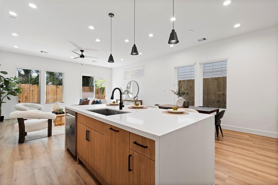 Windows thoughtfully placed around the living area flood the space with natural light, enhancing the open and airy atmosphere