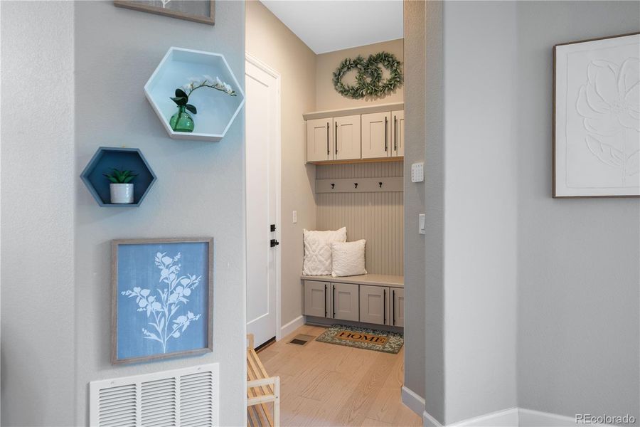 Entry way and mudroom with Coat closet off of the 3 Car Garage.