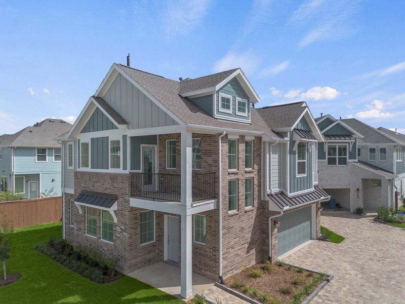 Front exterior of a new home in Meridiana, Manvel, TX, highlighting curb appeal (Image 2). Front exterior of a new home in Meridiana, Manvel, TX, highlighting curb appeal (Image 2).