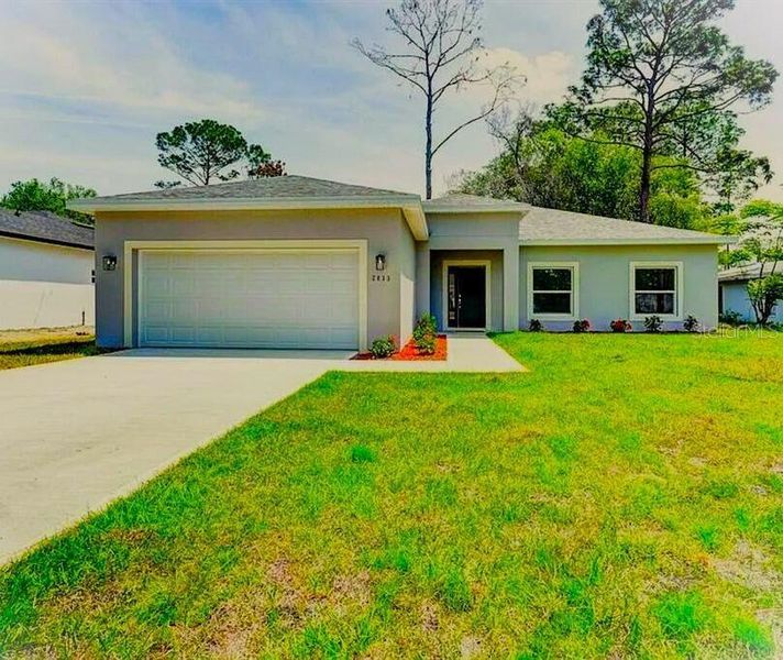 Front exterior of a new home in , Deland, FL, highlighting curb appeal (Image 20).