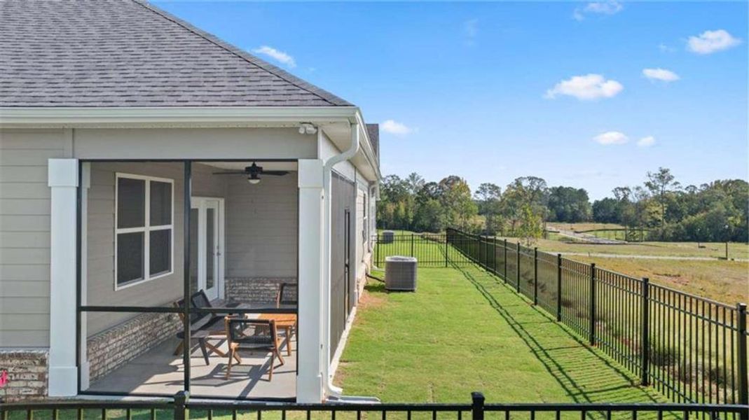 Exterior details and patio area of a home in Oak Ridge Meadows - Active Adult, Locust Grove (Image 4).
