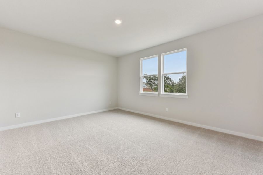 A room with a window and a white wall. A room with a window and a white wall.