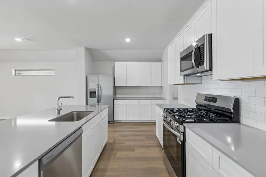 Kitchen in the Harrison home plan by Trophy Signature Homes – REPRESENTATIVE PHOTO Kitchen in the Harrison home plan by Trophy Signature Homes – REPRESENTATIVE PHOTO