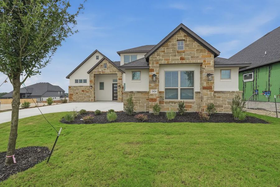 Representative exterior photo of a completed home built from the Stafford by Chesmar Homes in Prominence 60's, San Antonio, TX (Image 2). Representative exterior photo of a completed home built from the Stafford by Chesmar Homes in Prominence 60's, San Antonio, TX (Image 2).