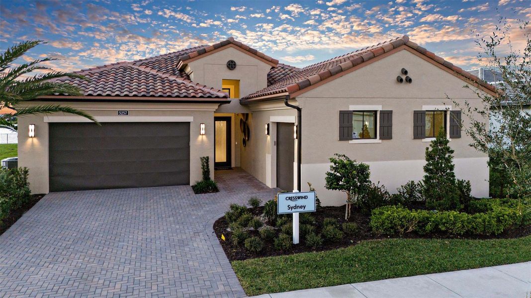 Front exterior of a new home in Cresswind Palm Beach at Westlake, Westlake, FL, highlighting curb appeal (Image 21).