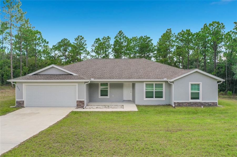Front exterior of a new home in , Dunnellon, FL, highlighting curb appeal (Image 28).