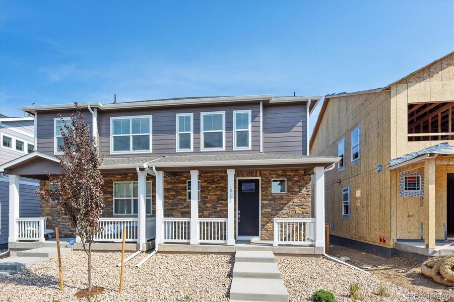 Exterior details and patio area of a home in Revere at Johnstown, Johnstown (Image 1).