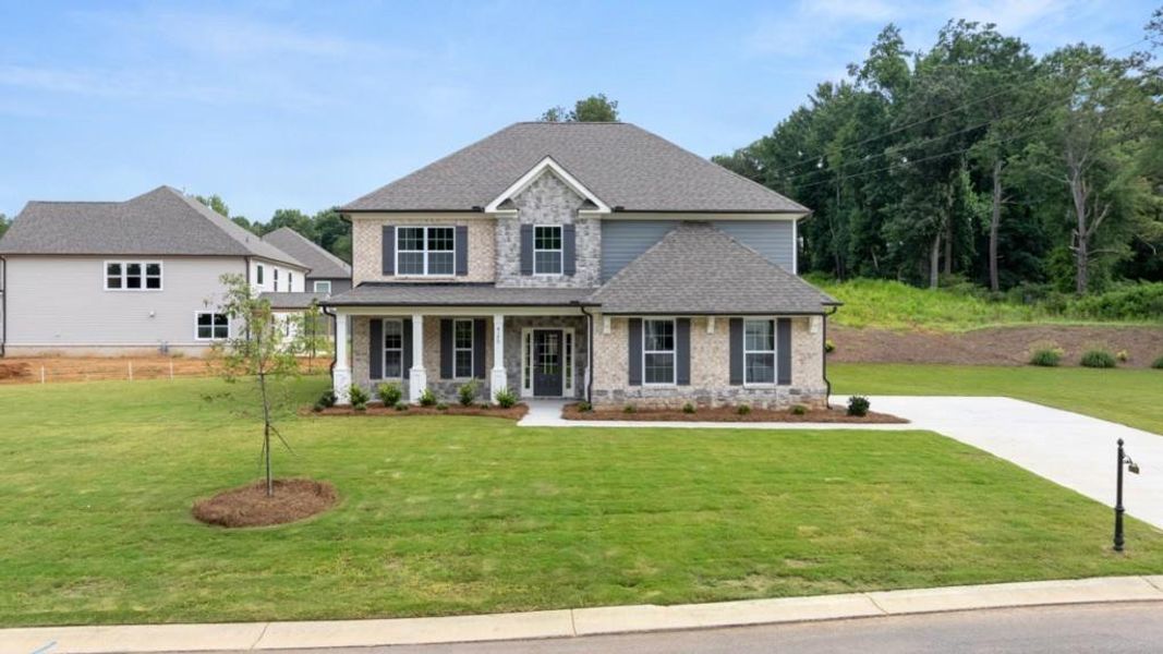 Front exterior of a new home in Haven Abbey, Cumming, GA, highlighting curb appeal (Image 1). Front exterior of a new home in Haven Abbey, Cumming, GA, highlighting curb appeal (Image 1).