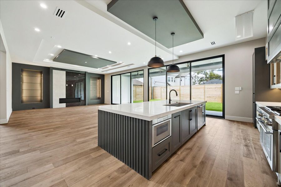 The open layout allows effortless connection to the expansive living area, while a convenient pass-through leads directly into the dining room—making this kitchen as ideal for entertaining as it is for everyday living.