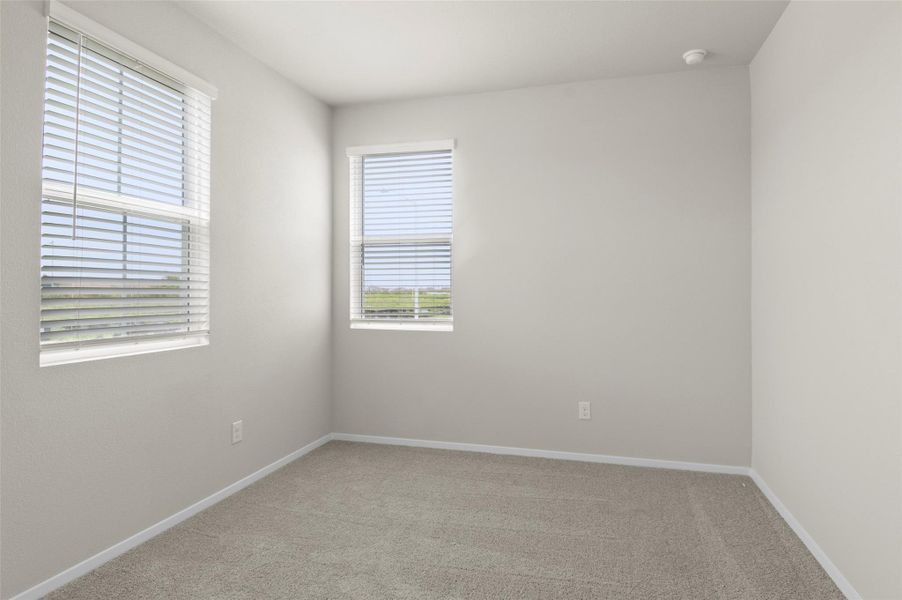 Spare room with light carpet Spare room with light carpet