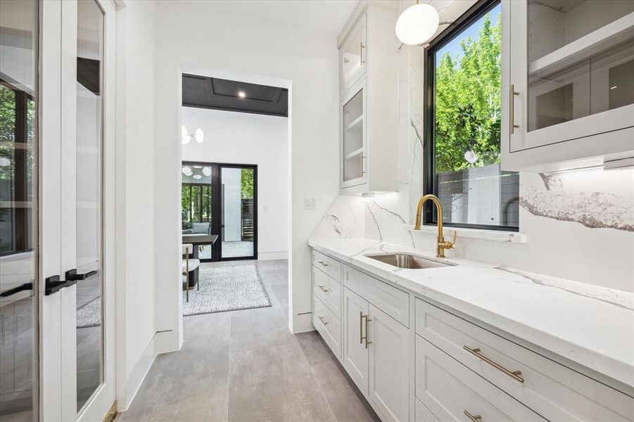 Service Pantry leading from the Kitchen to the Formal Dining Room and adjacent to the generous fitted walk-in Pantry