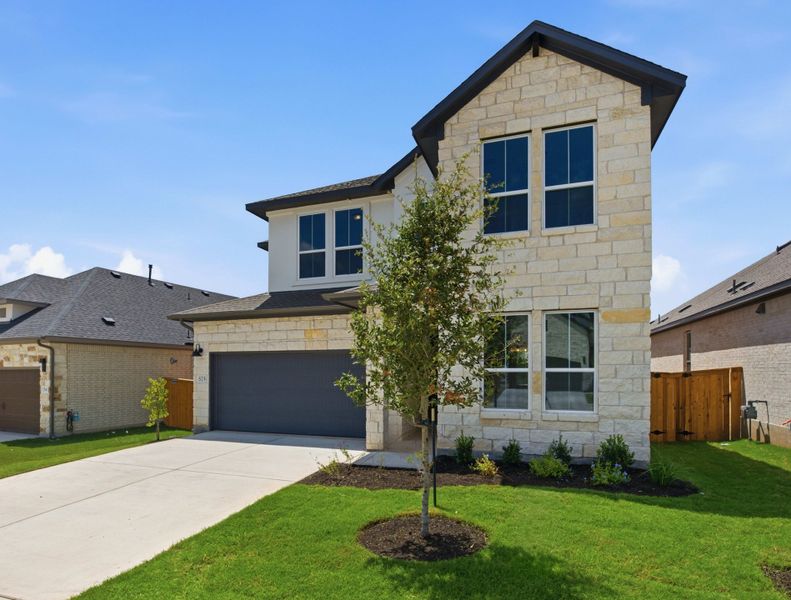 Front exterior of a new home in Heritage, Dripping Springs, TX, highlighting curb appeal (Image 23).