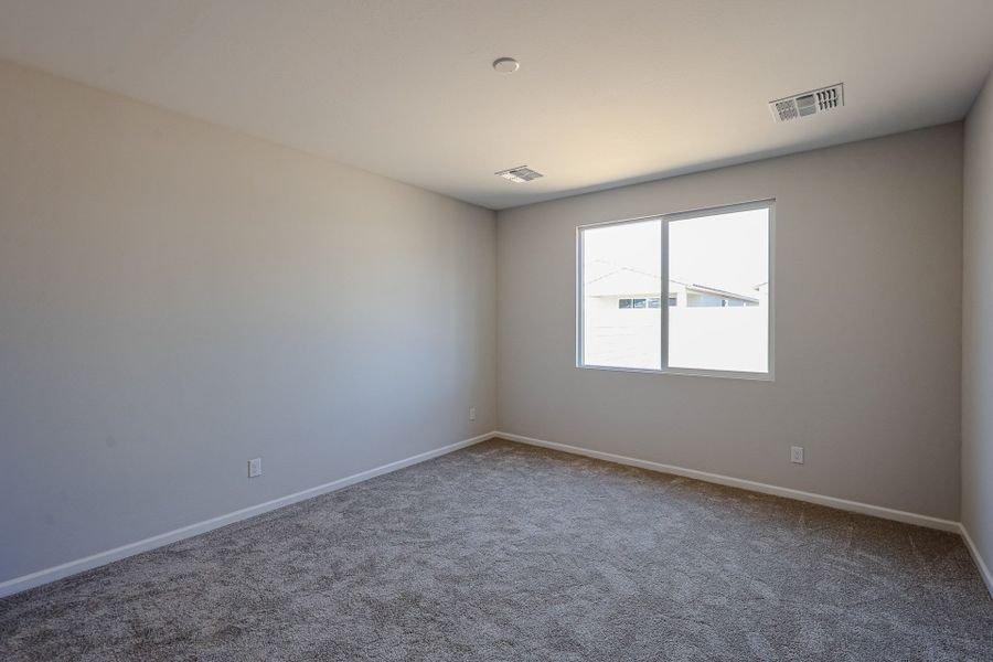 A room with a window and a carpet. A room with a window and a carpet.