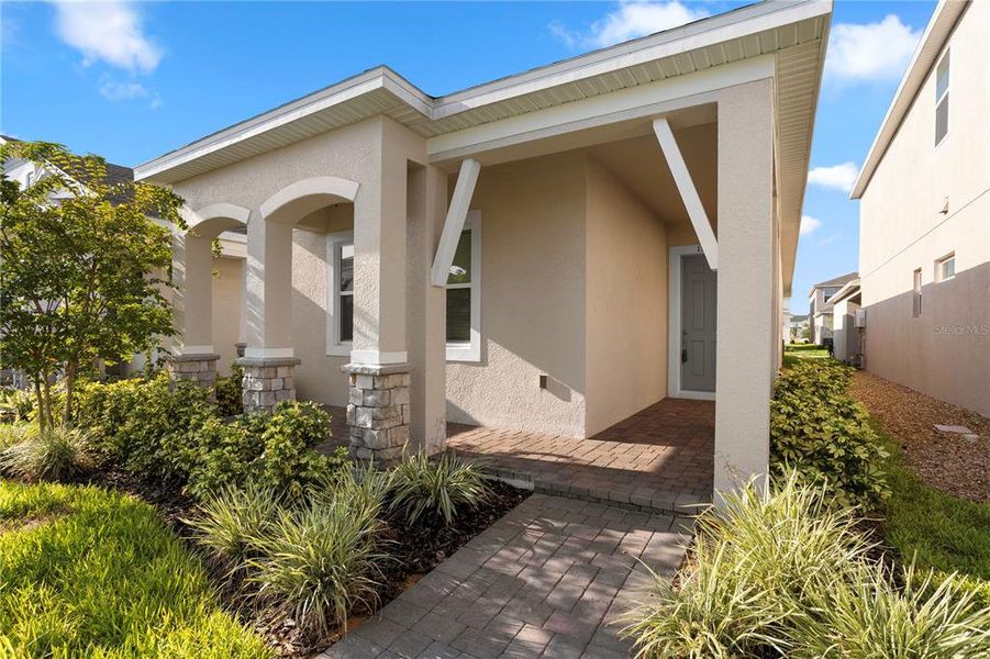 Front exterior of a new home in , Winter Garden, FL, highlighting curb appeal (Image 2).