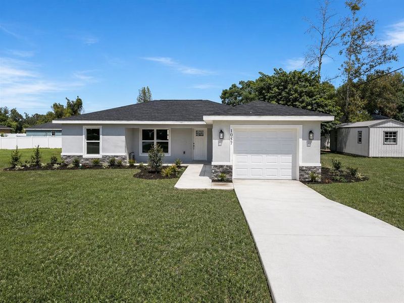 Front exterior of a new home in , Dunnellon, FL, highlighting curb appeal (Image 21).