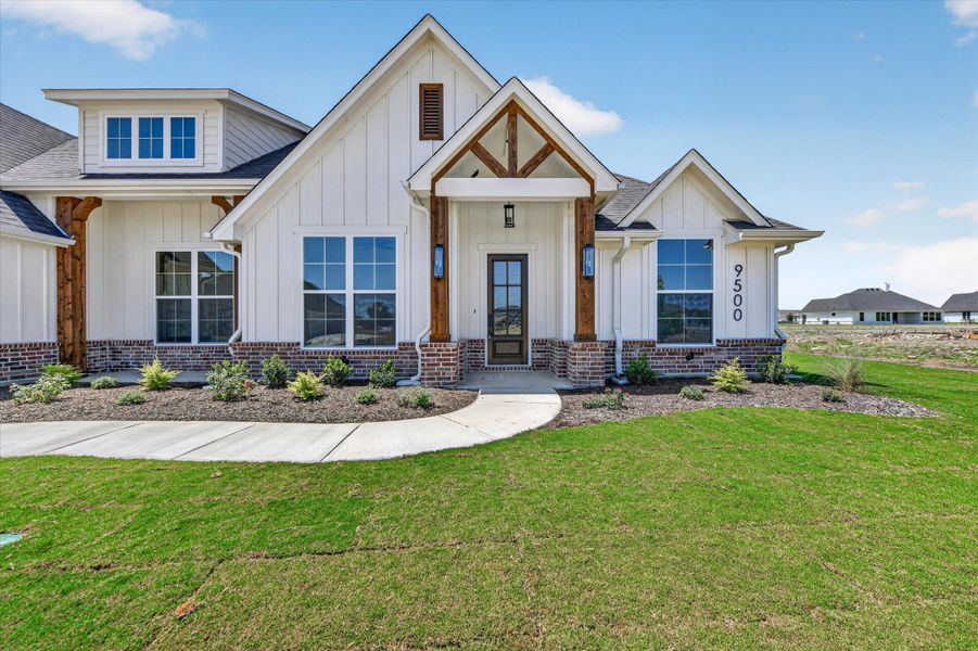 Front exterior of a new home in Paloma Ranches, Justin, TX, highlighting curb appeal (Image 24). Front exterior of a new home in Paloma Ranches, Justin, TX, highlighting curb appeal (Image 24).