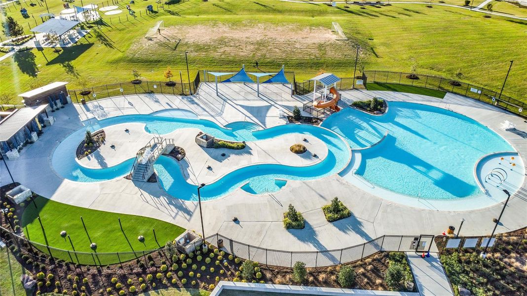 A lagoon-style pool area with multiple sections provides a standout recreational feature within the community and your own LAZY RIVER!