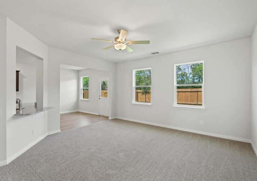 The family room of the Juniper plan has two large windows that let in great, natural light and backyard views.