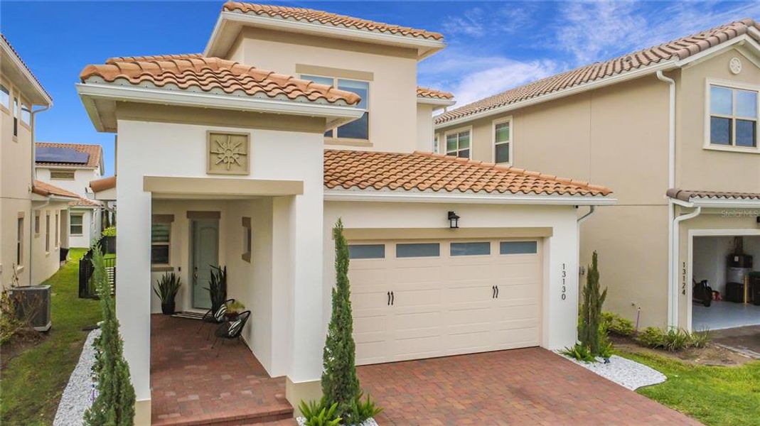 Front exterior of a new home in , Orlando, FL, highlighting curb appeal (Image 26).