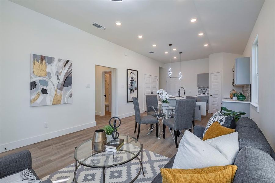 Living room with light hardwood / wood-style flooring