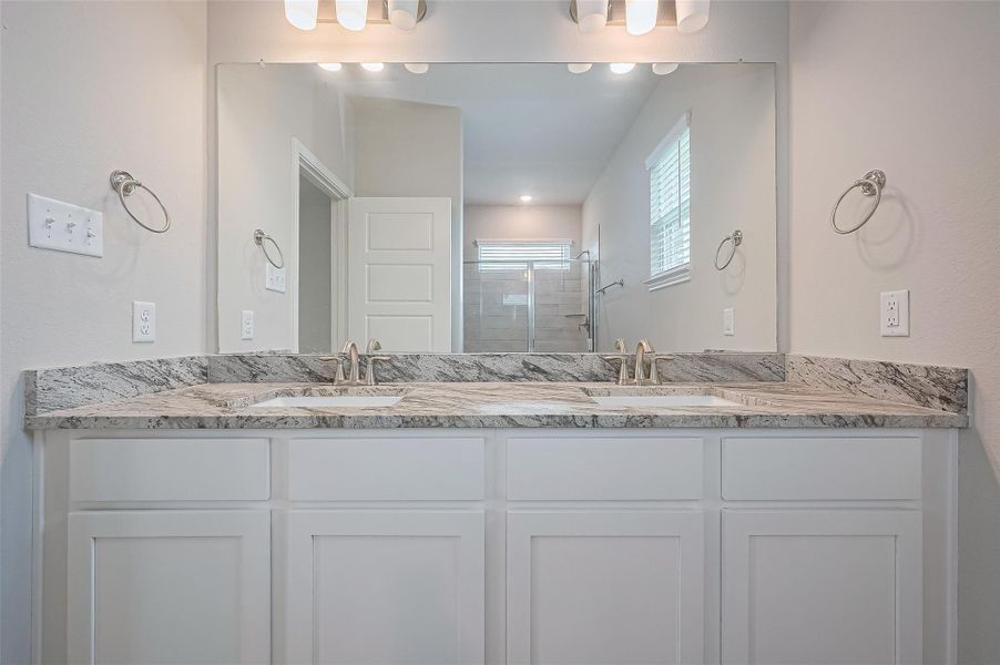 Furnished interior view inside a new home in Sunterra, Katy (Image 6).