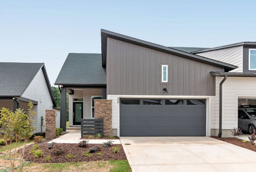 Front exterior of a new home in Encore at Chatham Park – Villa Series, Pittsboro, NC, highlighting curb appeal (Image 2). Front exterior of a new home in Encore at Chatham Park – Villa Series, Pittsboro, NC, highlighting curb appeal (Image 2).