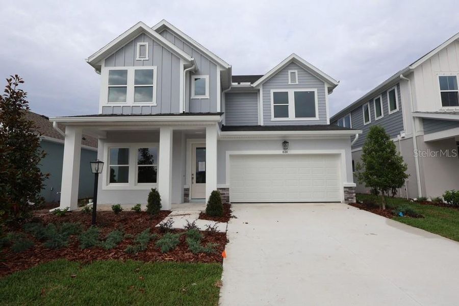 Front exterior of a new home in Eastlyn, Bradenton, FL, highlighting curb appeal (Image 8).