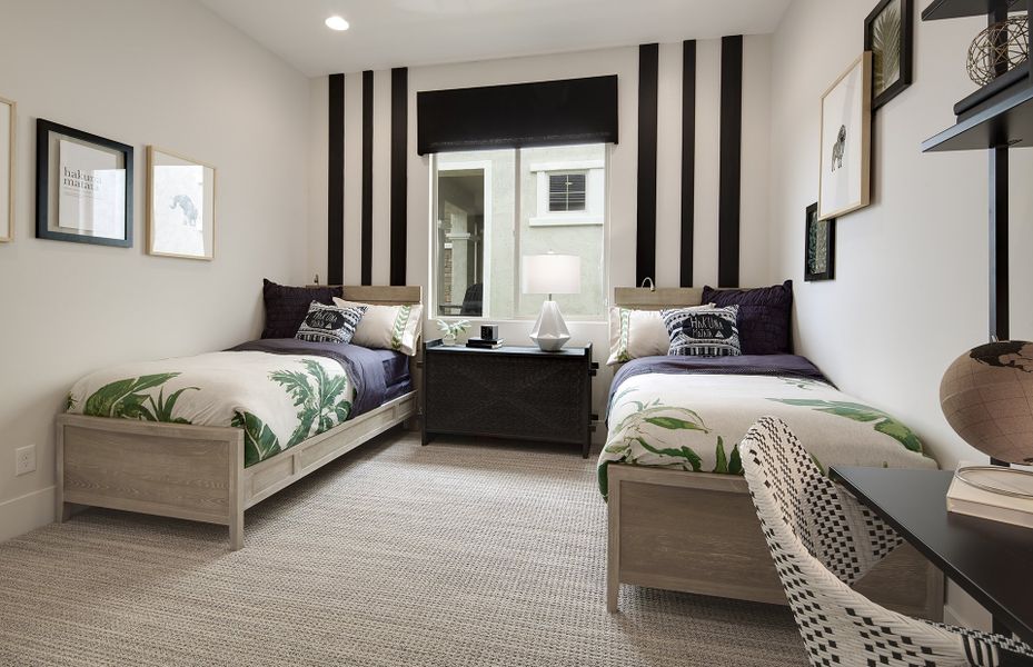 The secondary bedroom offers the flexibility to accommodate a children's room or hobby room