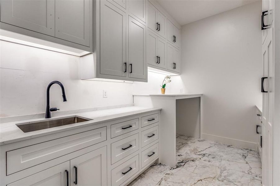 Clothes washing area with sink