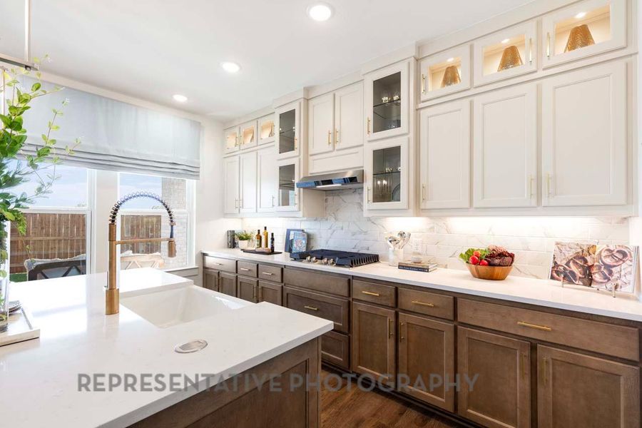 Kitchen with stainless steel gas cooktop, light countertops, white cabinetry, backsplash, and recessed lighting Kitchen with stainless steel gas cooktop, light countertops, white cabinetry, backsplash, and recessed lighting