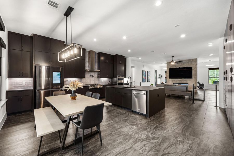 This photo showcases a modern, open-concept kitchen and living area. This photo showcases a modern, open-concept kitchen and living area.