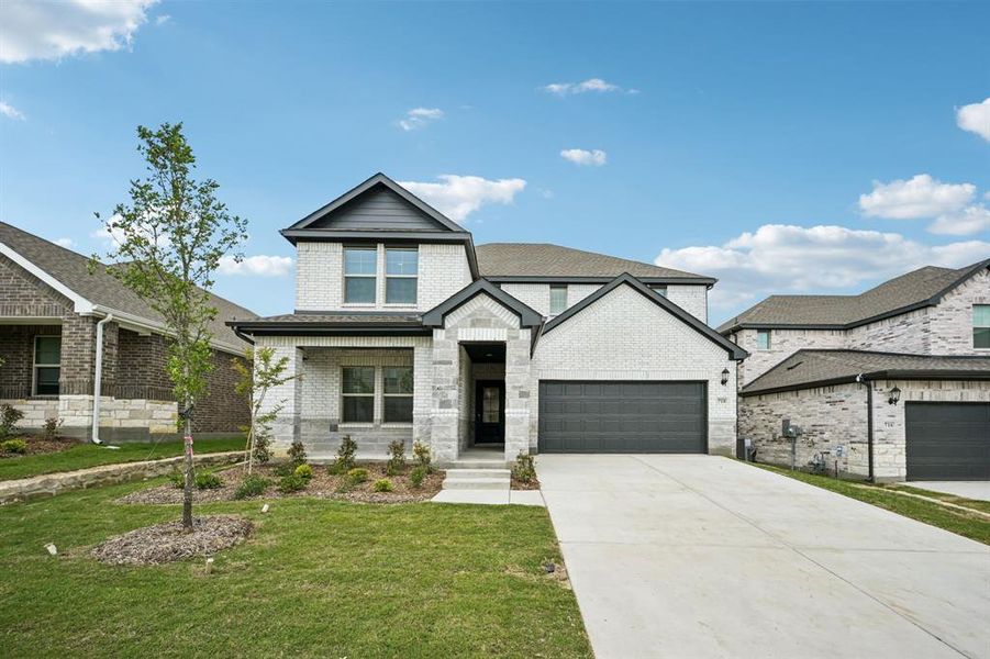 Front exterior of a new home in Eastridge - Signature Series, McKinney, TX, highlighting curb appeal (Image 1). Front exterior of a new home in Eastridge - Signature Series, McKinney, TX, highlighting curb appeal (Image 1).