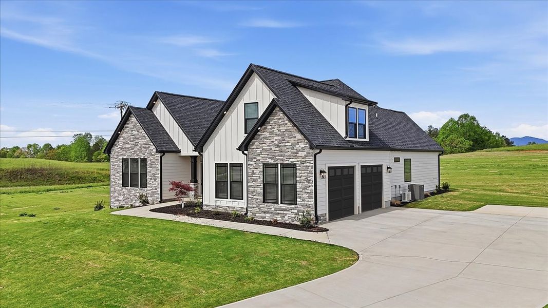 Representative exterior photo of a completed home built from the Beaumont Elite by Enchanted Homes in Lakeside at Blue Ridge Plantation, Taylors, SC (Image 24).