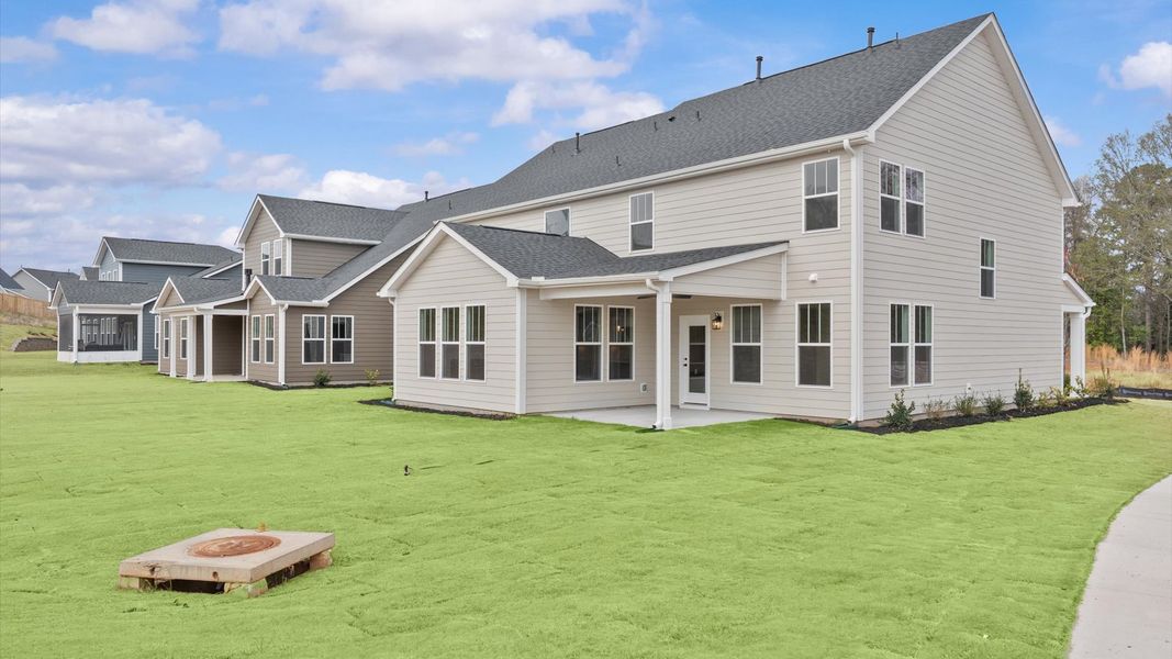Refined rear exterior with a stylish covered porch for dining, relaxing, or entertaining