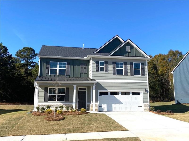 Front exterior of a new home in Preserve at Dove Creek, Statham, GA, highlighting curb appeal (Image 1). Front exterior of a new home in Preserve at Dove Creek, Statham, GA, highlighting curb appeal (Image 1).