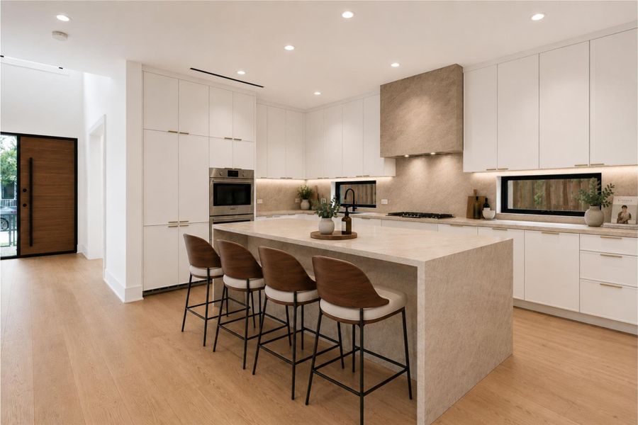 Breathtaking kitchen with Taj Mahal quartzite countertops. *Virtually staged.