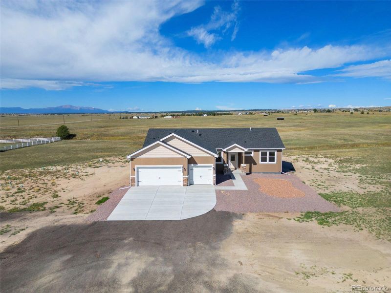 Front exterior of a new home in , Pueblo West, CO, highlighting curb appeal (Image 30).