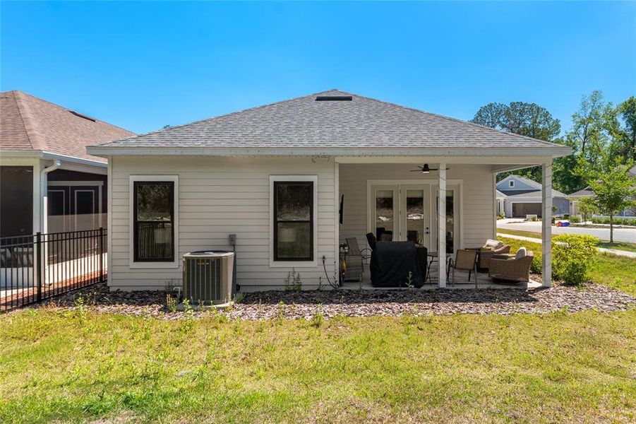 Exterior details and patio area of a home in Fairway Pointe at West End, Newberry (Image 36).