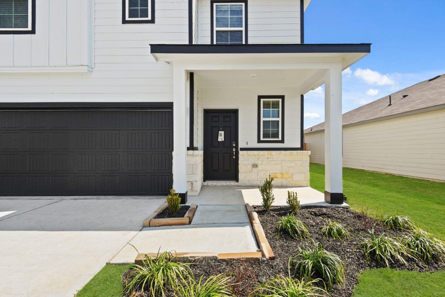 Front exterior of a new home in The Villages at Westpointe, Dayton, TX, highlighting curb appeal (Image 19). Front exterior of a new home in The Villages at Westpointe, Dayton, TX, highlighting curb appeal (Image 19).