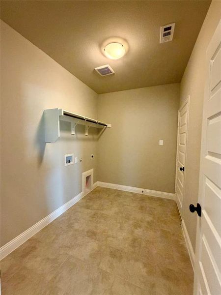Oversized launry room has extra room & plug for an extra fridge or freezer. This home will have decorator tile in laundry,