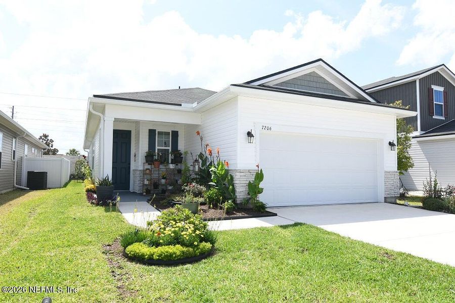Front exterior of a new home in Forest Crest, Jacksonville, FL, highlighting curb appeal (Image 20).