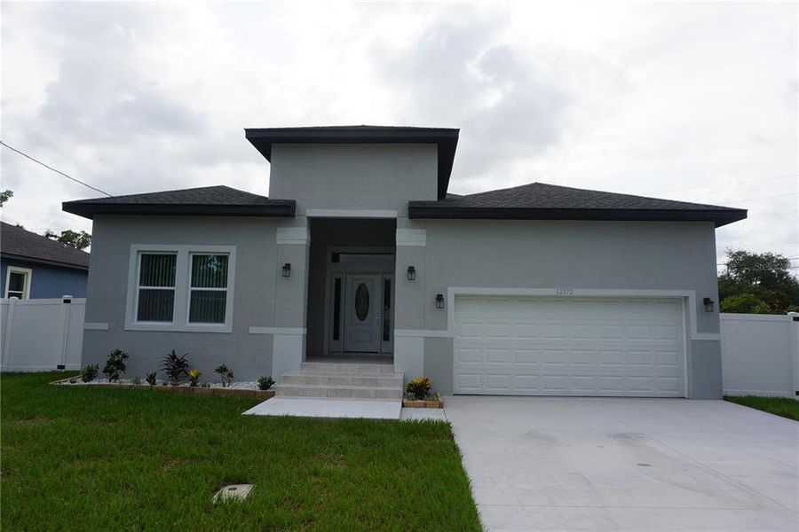 Front exterior of a new home in , Largo, FL, highlighting curb appeal (Image 2). Front exterior of a new home in , Largo, FL, highlighting curb appeal (Image 2).