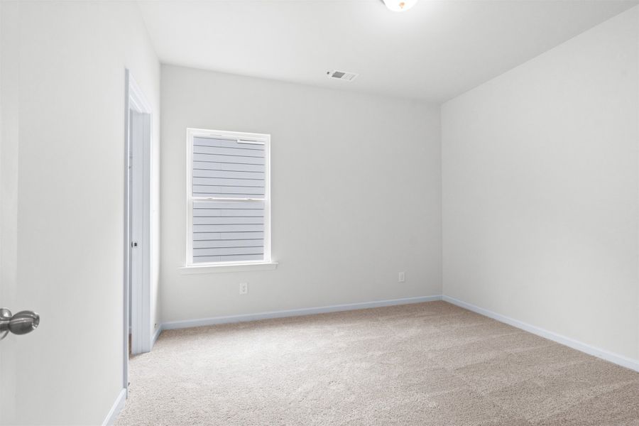 The Dove- Bedroom 3. Home under construction, photo used for illustrative purposes only, colors and options will vary.