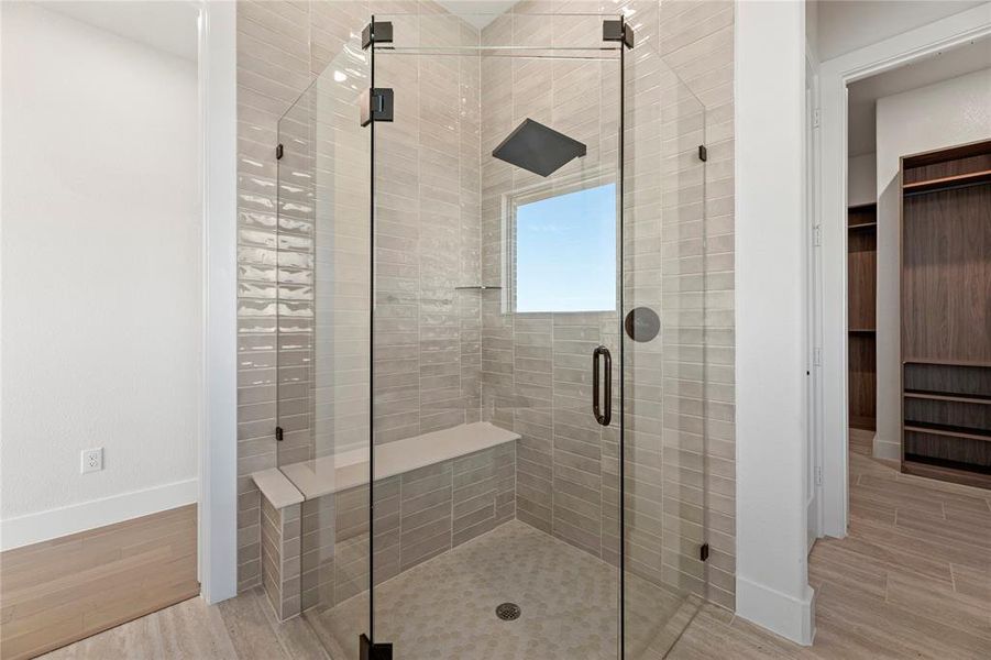 Bathroom with a shower with shower door