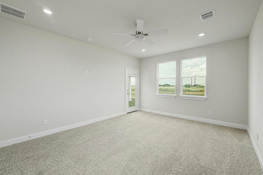 Spare room with a ceiling fan, light carpet, and recessed lighting