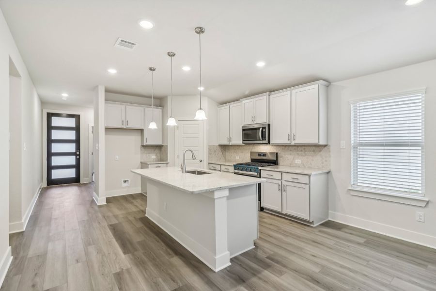 Kitchen in the Hughes floorplan at a Meritage Homes community.