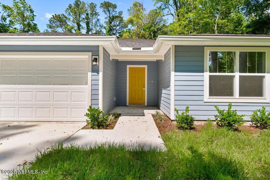 Front exterior of a new home in , Jacksonville, FL, highlighting curb appeal (Image 1).