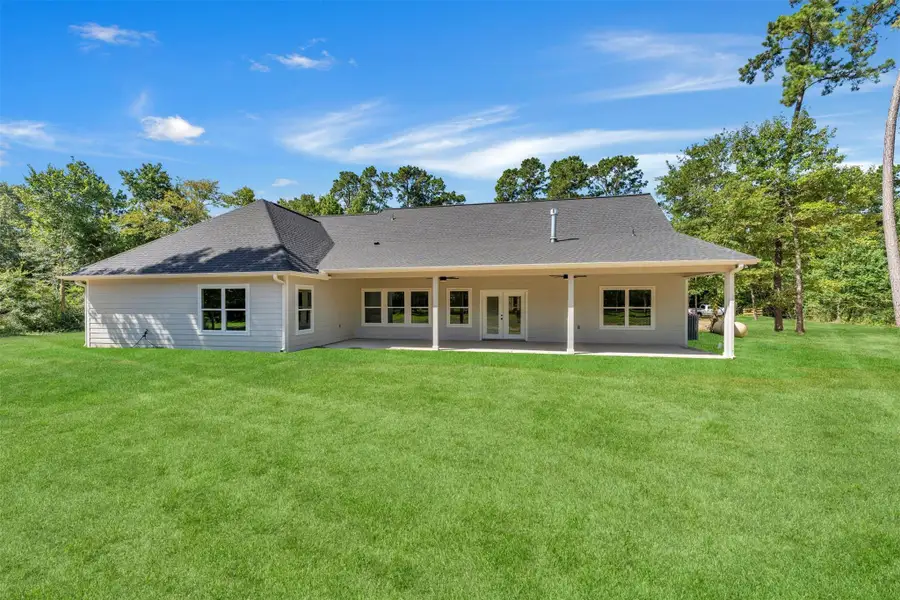 Exterior details and patio area of a home in , New Waverly (Image 25).