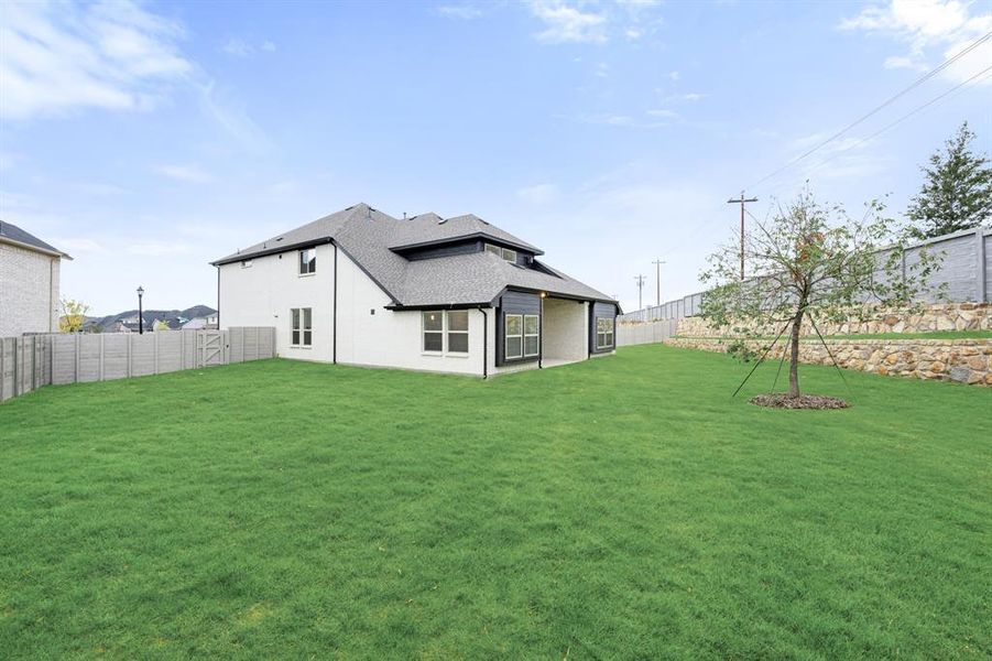 Exterior details and patio area of a home in Painted Tree Woodland District 50, McKinney (Image 4). Exterior details and patio area of a home in Painted Tree Woodland District 50, McKinney (Image 4).